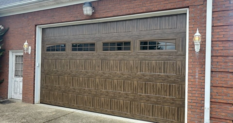 Garage door installation with dark paneled doors